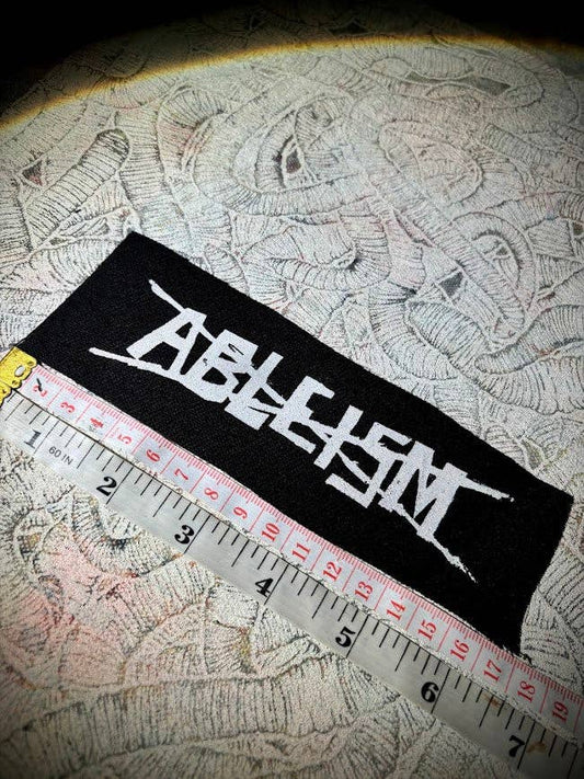 Stop ableism patch.: Black w/white ink